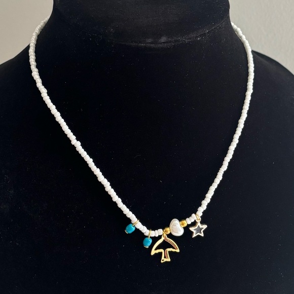 Handmade White Beaded Necklace with Gold Star and Charm - Picture 3 of 5